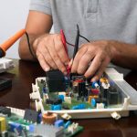 Man Working with Computer Components