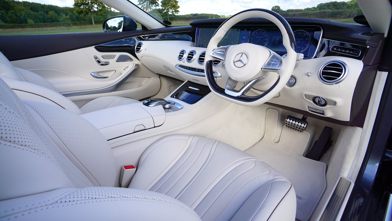 project-03-b Explore the luxurious interior design of a white Mercedes car showcasing modern automotive elegance.